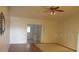 Bright living room with neutral walls, ceiling fan, and glass sliding doors offering a cozy atmosphere at 2014 Corner Meadow Cir, Orlando, FL 32820