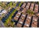 High-angle view of a residential area with uniform townhouses, mature trees, and well-maintained roads at 204 David Walker Dr # A-4, Tavares, FL 32778