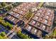 Overhead shot of a community showcasing uniform townhomes with terra cotta roofs, landscaping, and an inviting entrance at 204 David Walker Dr # A-4, Tavares, FL 32778