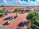 Aerial view of the Shanti Niketan 2 community featuring well-maintained landscaping and beautiful architecture at 204 David Walker Dr # A-4, Tavares, FL 32778