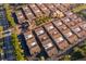 Aerial shot of a planned residential community showing organized townhomes with terra cotta roofs and landscaped surroundings at 204 David Walker Dr # A-4, Tavares, FL 32778