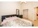 Inviting bedroom with a closet, neutral paint, and easy-to-clean tile floors at 204 David Walker Dr # A-4, Tavares, FL 32778