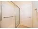 Accessible shower stall with grab bars and glass door for easy access at 204 David Walker Dr # A-4, Tavares, FL 32778