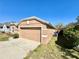 Side view showcasing the house's facade, driveway, and landscaping details at 2073 Newtown Rd, Groveland, FL 34736