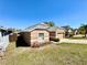 Side view showcasing the house's facade, driveway, and landscaping details at 2073 Newtown Rd, Groveland, FL 34736