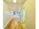 Inviting hallway with modern wood-look flooring leading to the main living areas at 2073 Newtown Rd, Groveland, FL 34736