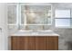 Bathroom with double sink vanity, large mirror, and modern tile at 2258 Crystal Falls Way, Orlando, FL 32824