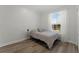 Bedroom featuring natural light, wood-look floors and light color scheme at 2258 Crystal Falls Way, Orlando, FL 32824