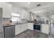 Modern kitchen with white cabinets, stainless appliances, subway tile backsplash, and granite counters at 2258 Crystal Falls Way, Orlando, FL 32824