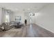 Open-concept living room features hardwood floors and a neutral color palette at 2258 Crystal Falls Way, Orlando, FL 32824