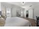 Bright main bedroom featuring a barn door leading to the ensuite and neutral tones at 2258 Crystal Falls Way, Orlando, FL 32824