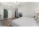 View of the main bedroom leading to a bathroom with sliding barn door, and computer desk at 2258 Crystal Falls Way, Orlando, FL 32824