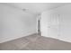 Bedroom with carpet, neutral walls, and white trim, providing a blank canvas for personalization at 2306 Lancashire St, Davenport, FL 33896