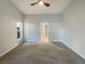 Neutral bedroom featuring a ceiling fan, with lots of natural light; and carpet floors at 2350 Blue Sapphire Cir, Orlando, FL 32837