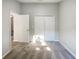 Carpeted bedroom featuring bi-fold closet and door with neutral paint and ample space at 2350 Blue Sapphire Cir, Orlando, FL 32837