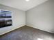 Bedroom showcasing a window, neutral paint, and plush carpet at 2350 Blue Sapphire Cir, Orlando, FL 32837