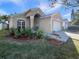 Beautiful home with well-maintained landscaping, a two-car garage, and a welcoming facade at 2350 Blue Sapphire Cir, Orlando, FL 32837