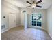 Foyer featuring tile flooring, natural light from an arched window, and neutral wall paint at 2350 Blue Sapphire Cir, Orlando, FL 32837