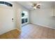 Inviting foyer featuring tile flooring, natural light from an arched window, and neutral wall paint at 2350 Blue Sapphire Cir, Orlando, FL 32837