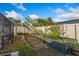 Private backyard with raised garden beds, lush greenery and privacy fence perfect for outdoor relaxation at 2821 Lone Feather Dr, Orlando, FL 32837