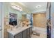 Well lit bathroom with shower-tub combo, neutral tile, and modern fixtures at 2821 Lone Feather Dr, Orlando, FL 32837