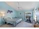 Comfortable bedroom with a ceiling fan, carpet floors and a bike at 2821 Lone Feather Dr, Orlando, FL 32837