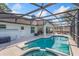 Beautiful pool and spa with screened lanai and covered seating area at 2821 Lone Feather Dr, Orlando, FL 32837