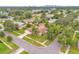 Aerial view of the property in a neighborhood with mature trees and in-ground pool at 3052 Saratoga Dr, Orlando, FL 32806