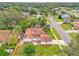 Back aerial view of the home showcasing a well-maintained roof, backyard, street, and surrounding neighborhood at 3052 Saratoga Dr, Orlando, FL 32806