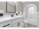 Bathroom featuring white cabinets, a neutral countertop, a mirror and a bathtub at 3052 Saratoga Dr, Orlando, FL 32806