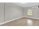 An empty bedroom with light-colored wood floors and a mini-split air conditioner at 3052 Saratoga Dr, Orlando, FL 32806