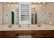 Bathroom featuring a double sink vanity, neutral walls, and bright lighting at 316 Trieste Loop, Lake Mary, FL 32746