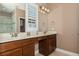 Bathroom with double sink vanity, and a shower with glass door at 316 Trieste Loop, Lake Mary, FL 32746