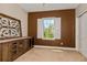 Bedroom features beautiful wood cabinet and shutters on the window overlooking mature trees at 316 Trieste Loop, Lake Mary, FL 32746