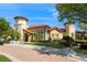 Beautiful clubhouse featuring a tile roof, stucco exterior, and manicured landscaping for an inviting atmosphere at 316 Trieste Loop, Lake Mary, FL 32746