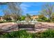 Community water fountain on a sunny day, enhancing the appeal of the surrounding residences at 316 Trieste Loop, Lake Mary, FL 32746