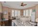 Cozy living room with large sectional sofa, area rug, and bright windows, creating a welcoming atmosphere at 316 Trieste Loop, Lake Mary, FL 32746