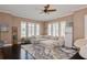 Bright living room featuring dark hardwood floors, neutral walls, plush sectional, and vintage style refrigerator at 316 Trieste Loop, Lake Mary, FL 32746