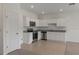 Bright kitchen featuring stainless steel appliances, white cabinetry, and granite countertops at 3483 Vesara Dr, Davenport, FL 33837