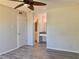 Bedroom showcasing wood-look floors and a bathroom vanity area with double mirrors at 3772 Idlebrook Cir # 210, Casselberry, FL 32707