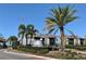 Cabana Key community sign with landscaping and palm trees against a blue sky at 3772 Idlebrook Cir # 210, Casselberry, FL 32707