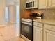 Clean kitchen with stainless steel appliances and white cabinets for modern cooking at 3772 Idlebrook Cir # 210, Casselberry, FL 32707