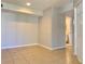 Cozy living room with tile flooring and neutral walls, leading to the bathroom at 3772 Idlebrook Cir # 210, Casselberry, FL 32707