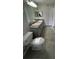 Bright bathroom featuring double sinks, large mirror, updated cabinets and stylish tile flooring at 413 Summit Ridge Pl # 115, Longwood, FL 32779