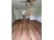 Bedroom featuring wood floors, closet, and bathroom access at 413 Summit Ridge Pl # 115, Longwood, FL 32779