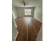 Bedroom featuring wood floors and lots of natural light at 413 Summit Ridge Pl # 115, Longwood, FL 32779
