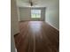 Bedroom featuring wood floors and lots of natural light at 413 Summit Ridge Pl # 115, Longwood, FL 32779