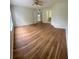 Large bedroom with a ceiling fan and entrances into a bathroom and closet at 413 Summit Ridge Pl # 115, Longwood, FL 32779