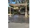 Community car washing station with marked parking and car wash sign at 413 Summit Ridge Pl # 115, Longwood, FL 32779