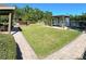 Beautiful view of a pergola with a table and chairs next to the lake at 413 Summit Ridge Pl # 115, Longwood, FL 32779